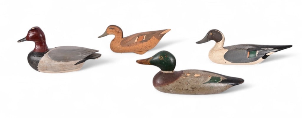 Collection of Vintage Carved Duck Decoys: Four vintage duck decoys, two glass-eyed
