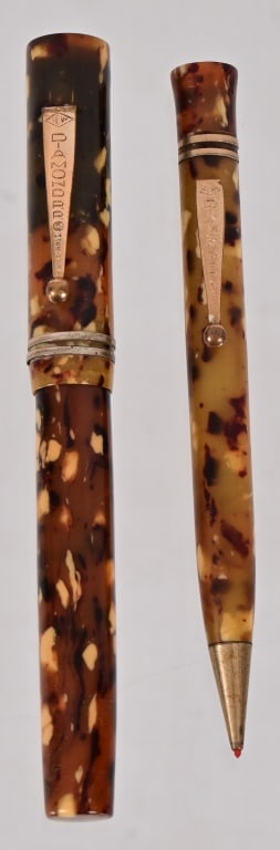 Vintage Diamond Point Fountain Pen Set: Diamond Point celluloid fountain pen with 14k nib; Matching Mechanical celluloid red pencil. Circa 1930's
