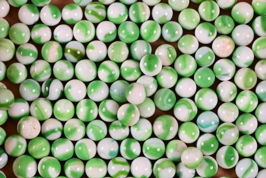 Collection of 172 Vintage Green and White Swirl Marbles: Collection of 172 Vintage Green and White Swirl Marbles. All in Excellent Condition. Measure Approx. 1/2 inch in diameter.