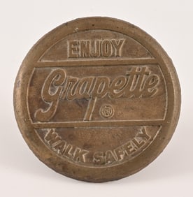 Grapette Brass Sidewalk Marker