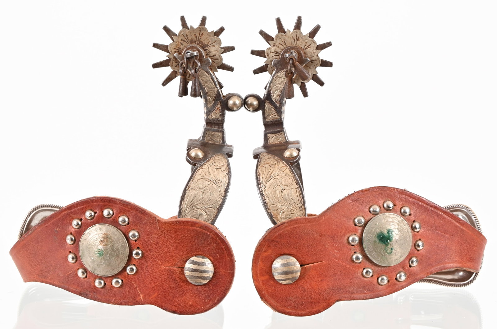 E. Garcia Type Unmarked Silver Inlaid Spurs: California style spurs with nice straps. Engraved silver inlay across heel band and shank. Adorned with jinglebobs and engraved rowel covers.