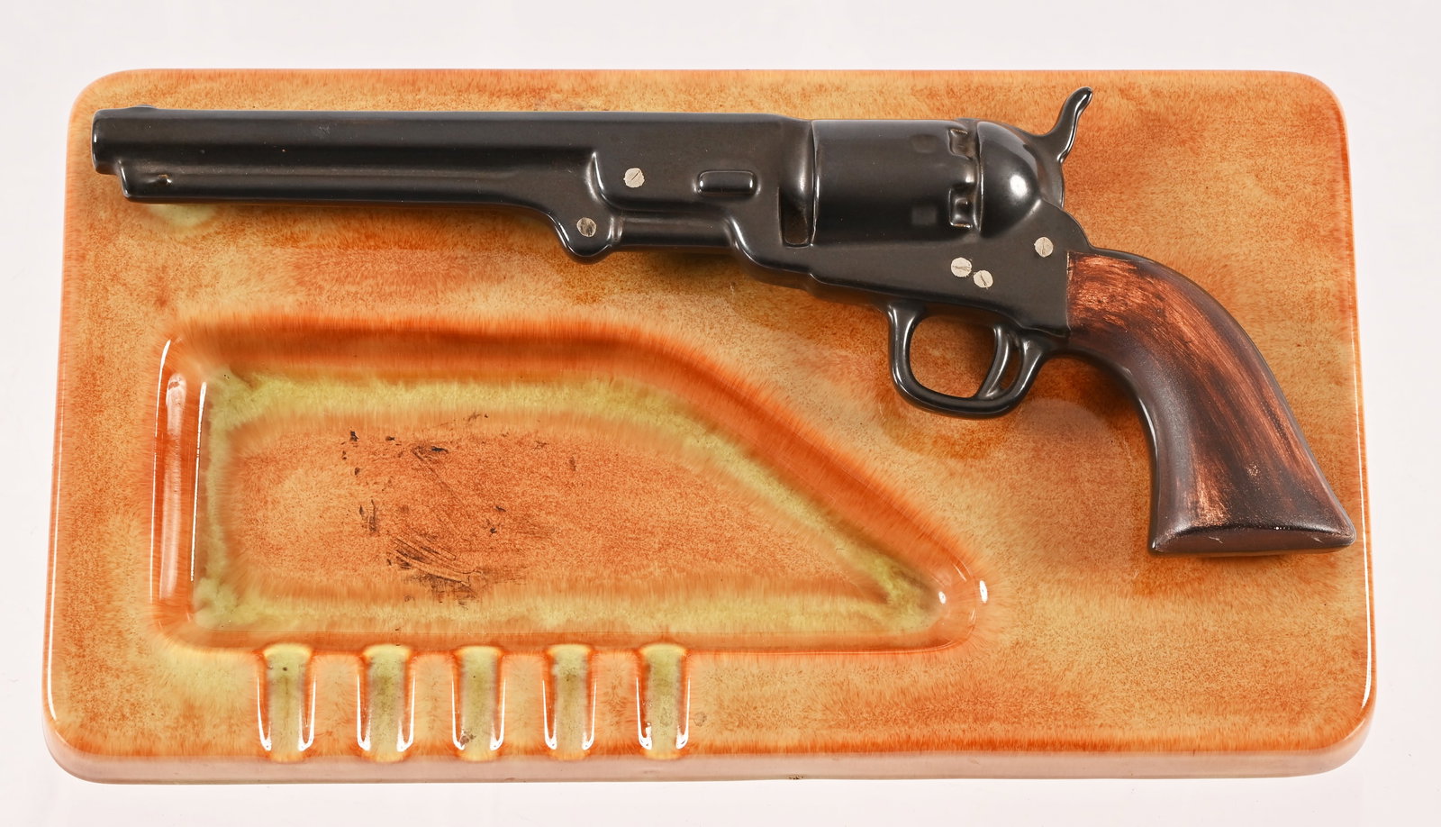 Vintage Holland Mold Co. Ceramic Revolver Ashtray: Ceramic Ashtray by Holland Mold Co. Signed by artist Vera Lamphere, 1966. Very nice depiction of Colt Navy revolver. Measures 2" x 7" x 13.25".