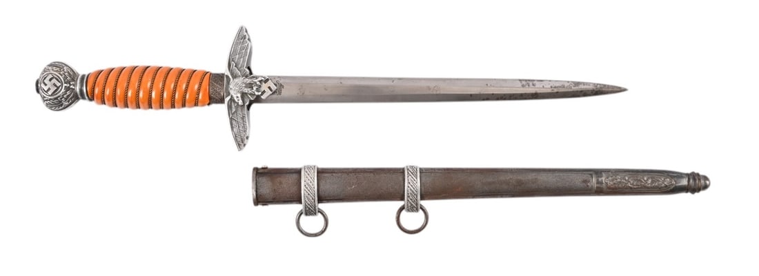 German Luffwaffe Dagger with Sheath: Second model, made by Alcoso. 9 3/4" blade, ornate handle. Metal sheath with fittings in good condition.