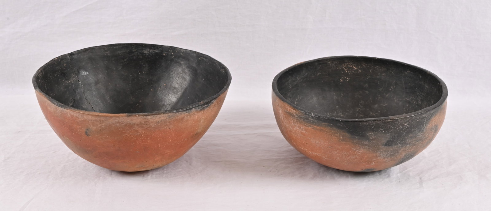 Ancient Anasazi Indian Pottery Bowls (2): Anasazi people inhabited the Four Corners region of the United States from about 100 AD-1300 AD. One bowl measures approximately 5" x 10", does have crack through with what appears to be museum grade 