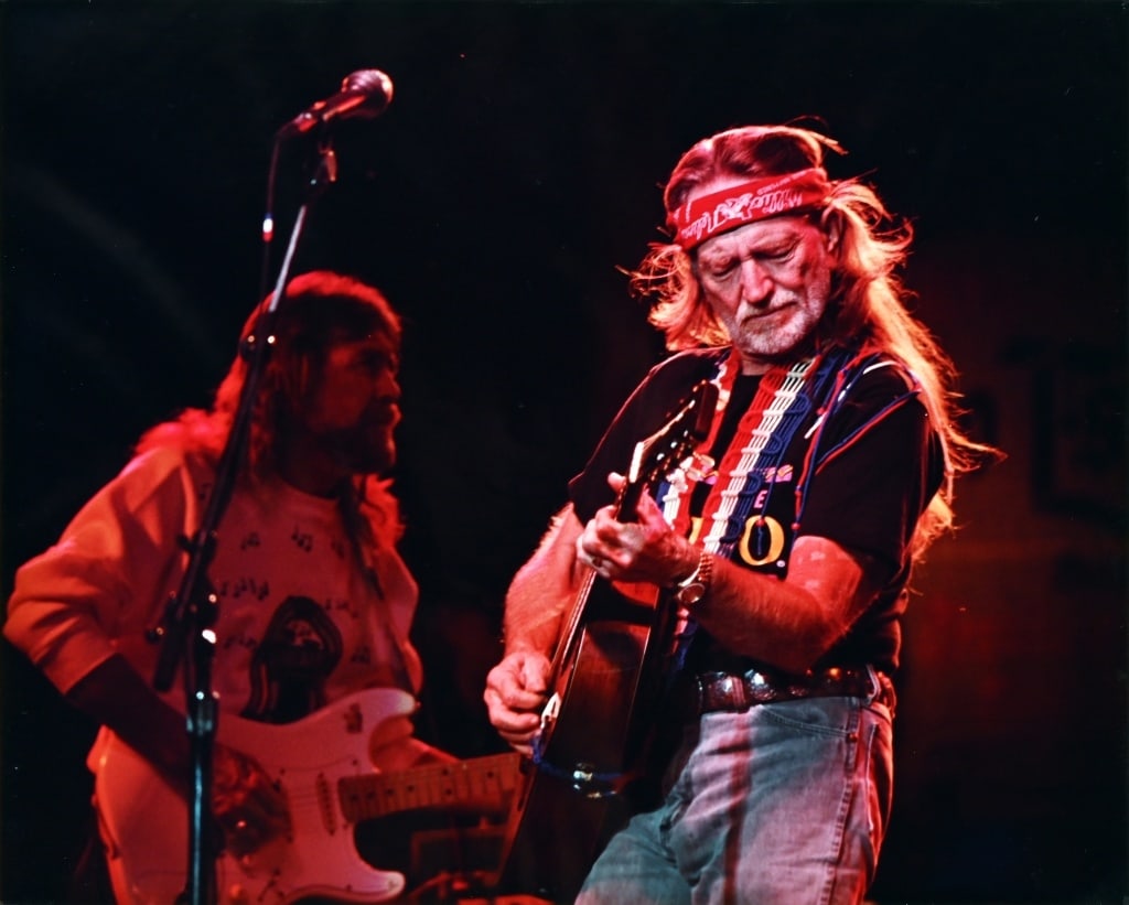 Willie Nelson Concert Photo by Jerry Somers 1992: Framed concert photo taken by Jerry Somers. Taken in Bloomburg, PA October 3, 1992 and has personal hand written note from Jerry and Wil Somers on back of frame thanking Willie for meeting him and sho