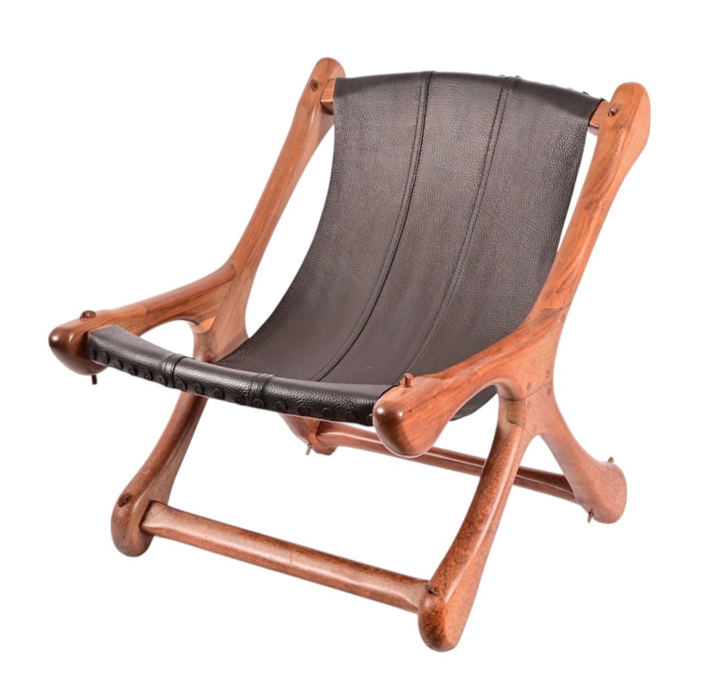 Don Shoemaker 1960's "Sloucher" Lounge Chair: Hand-made leather and wood Mid-Century chair by Don Shoemaker. Likely made of rosewood, Shoemaker utilizes no modern hardware in manufacturing. Chair measures 23" x 27" x 27" RECOMMEND LOCAL PICKUP.