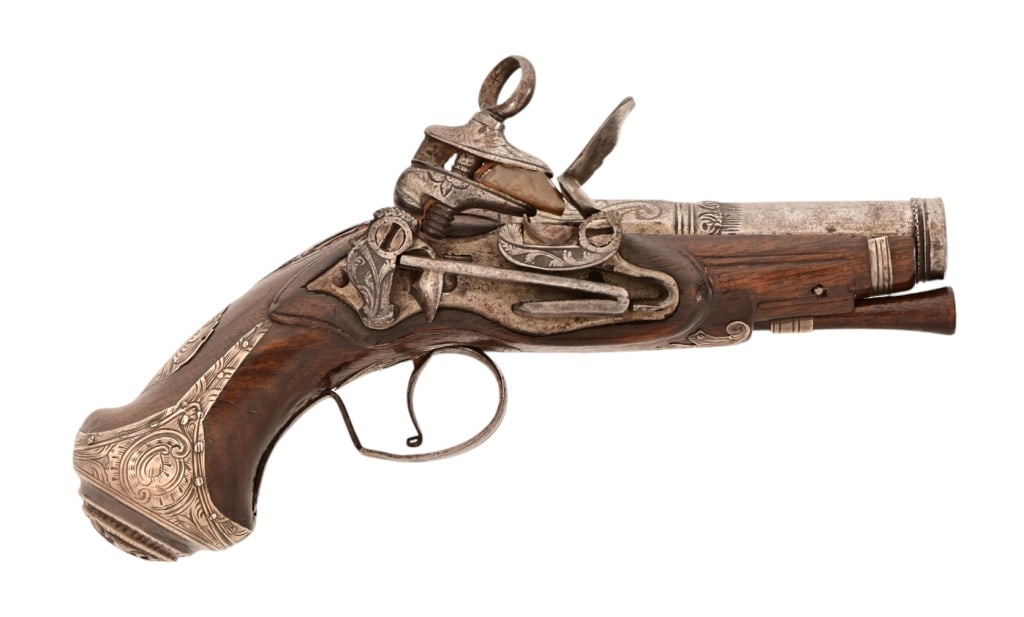 Spanish Silver Mounted Miquelet Pocket Pistol: Beautiful Silver-Mounted Spanish Miquelet flintlock pocket pistol. 3.25" barrel. .54 caliber. Metal is even gray patina with engraving. Wood is very nice.
