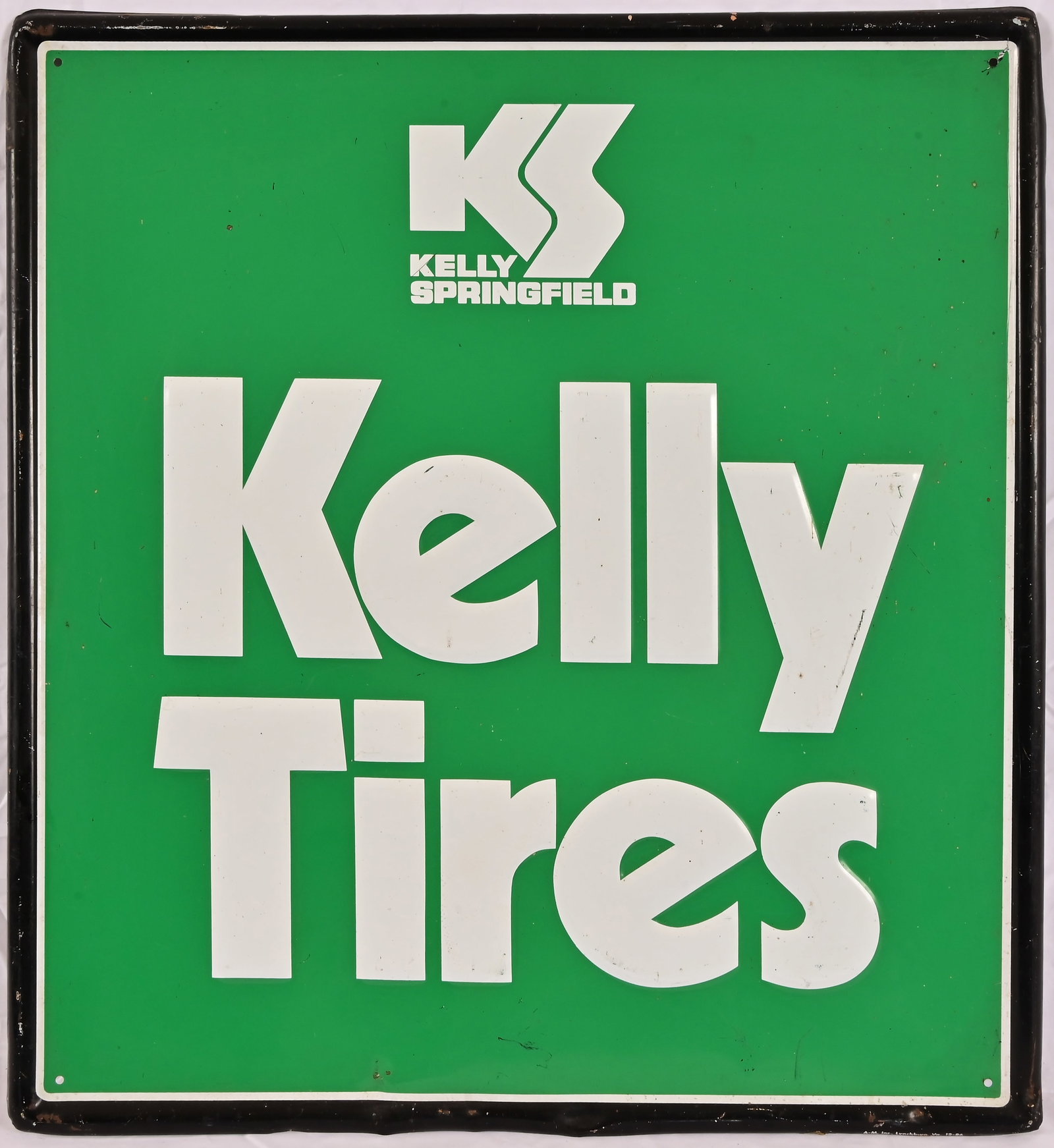 Kelly Tires Embossed Tin Sign c.1986: Manufactured by A-M Inc., Lynchburg Va,. 12-86. Measures 23.75" x 25.75"
