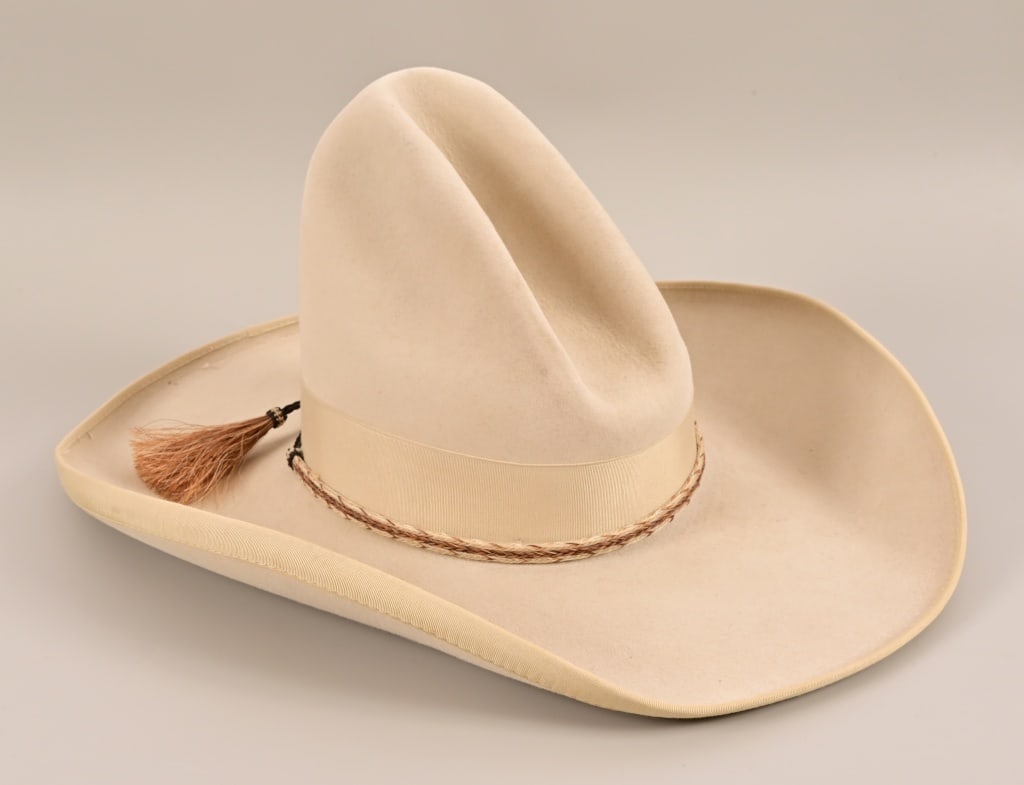 John B. Stetson 4X Beaver Cowboy Hat: 7 1/8" Silver Belly color. Ribbon brim, horsehair band with tassles, "Gus" crease