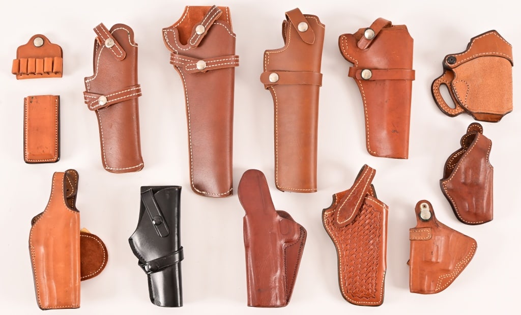 Collection of (13) Leather Pistol Holsters: 13 various holsters/holders. Makers include; Hunter, Bucheimer, Smith & Wesson, Bianchi. 1 Bianchi 45 auto magazine holder . 1 Bianchi 6 round bullet holder.
