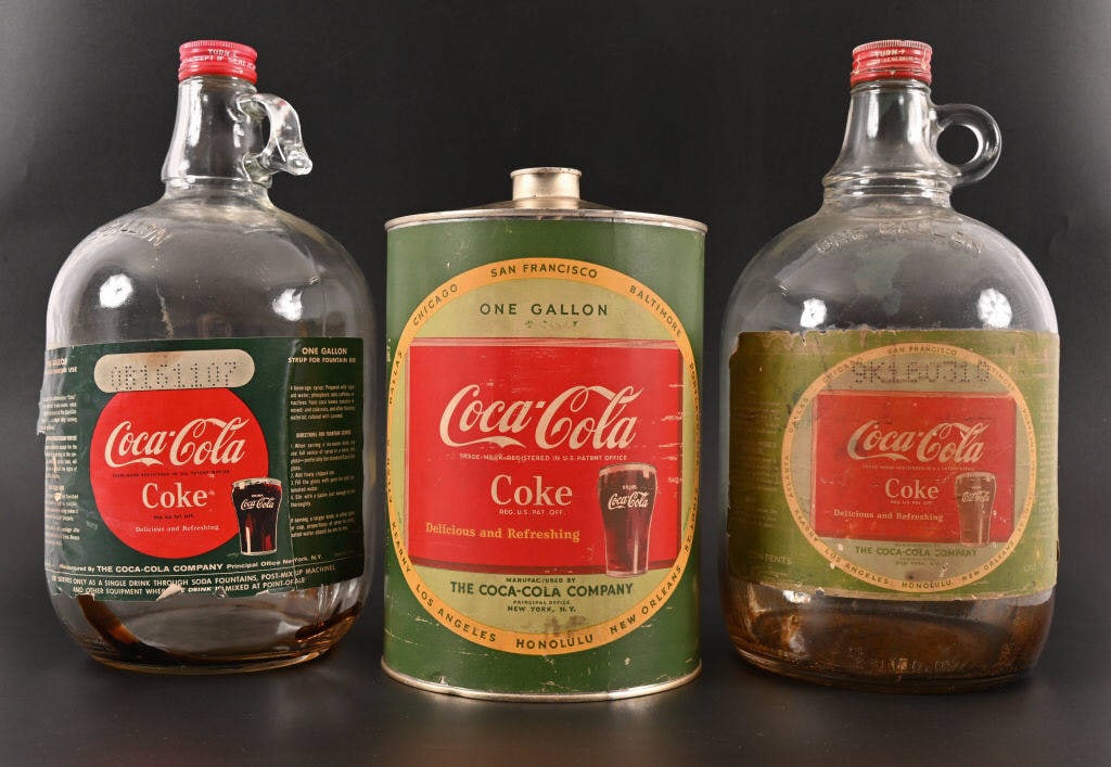 Collection of (3) Coca-Cola Syrup Containers: (2) Glass, (1) Tin