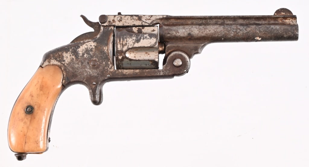 Smith & Wesson .38 S&W Spur Trigger Revolver: Antique Smith & Wesson Single Action Pocket Revolver. $" barrel, dark bore. Action works, missing privet screw, bone grips. Approximately 20 % nickel finish remains. SN 8250. Antique.