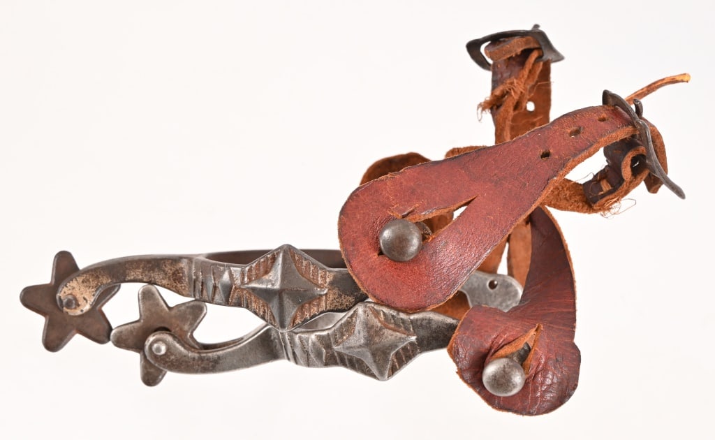 Pair Of Kids Spurs: Unmarked with leather straps.