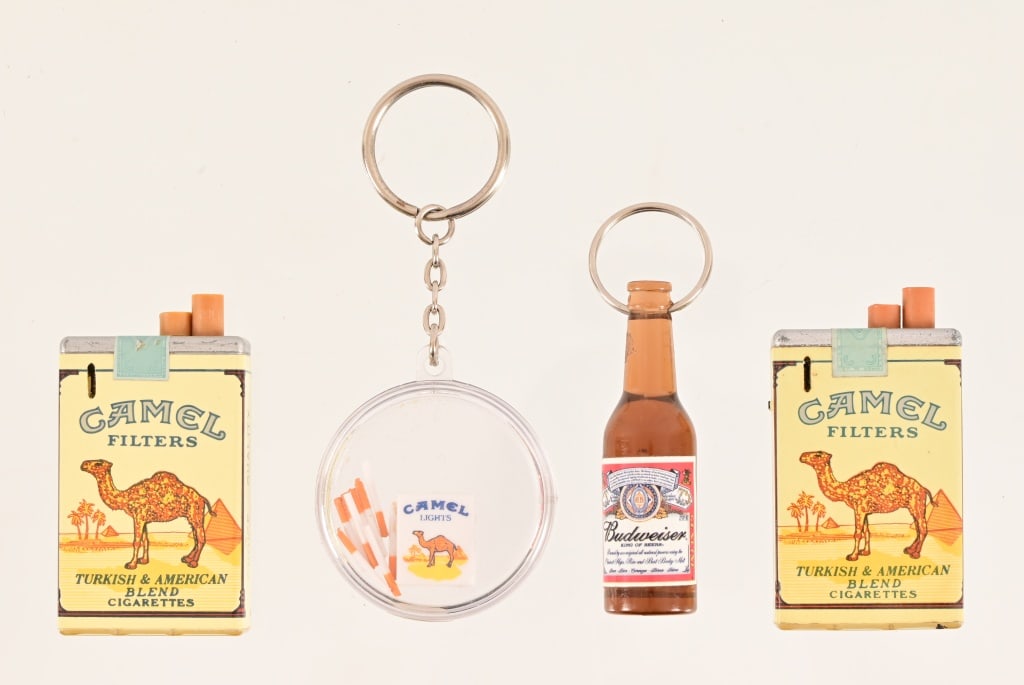 Camel Cigarettes Vintage Memorabilia Items: (2) Working Lighters, Keychain game; Also included is Budweiser bottle opener keychain