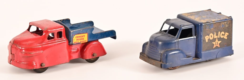 (2) Vintage Pressed Steel Toy Truck: Police Wagon friction car has lower pressed steel frame with plastic upper body, 1.75" x 4"; Cement Truck is missing the mixer, 1.75" x 5"