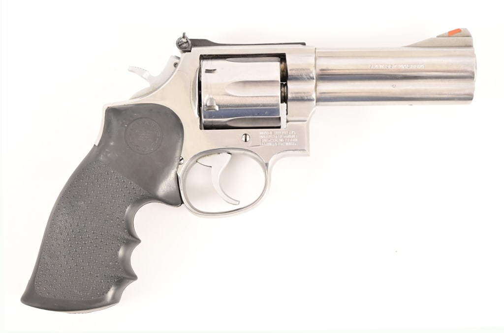 S&W Model 686 Revolver Police Marked .357 Magnum: S/N ABC9827. Police arsenal marked "C.P.D. 19". Stainless finish, 4" barrel, rubber grips. Good bore and action, original box. Modern