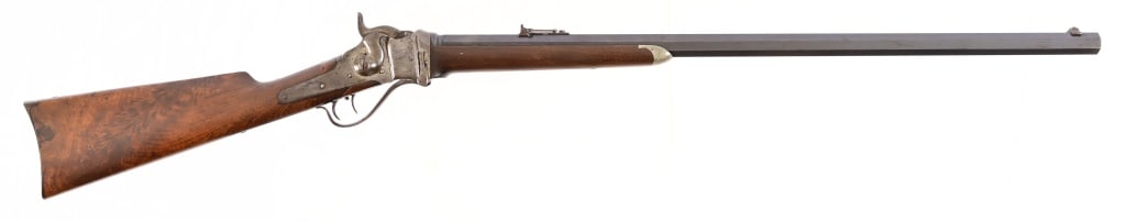 Sharps 1874 Breech-Loading Rifle .44 24: S/N C52964. Heavy octagonal 30" barrel, Rear elevation sight. Very nice figured stock. Double set triggers. Stamped near breech end of barrel reads "calibre 44 24". Barrell in front of rear sight read