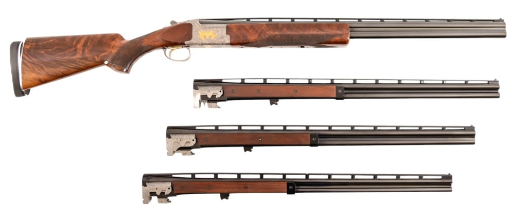 Engraved Deluxe Browning O/U Shotgun, 4 Barrel Set: S/N 17550NM6A3. Engraved receiver with gold pheasant scene. Deluxe checkered stock. Four 28-inch barrel sets ranging from .410, .28, .20, 12 Gauge. Modern