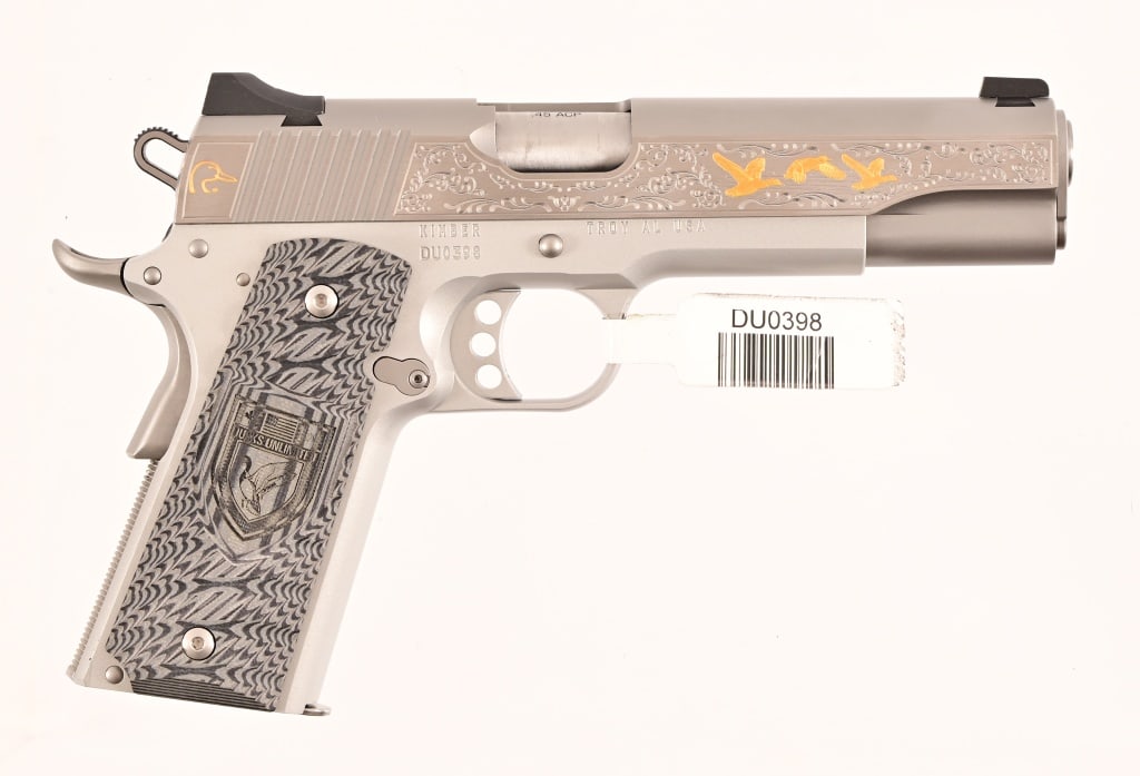 Kimber Ducks Unlimited 1911 Semi-Auto .45 ACP: S/N DU0398. Engraved slide with gold-plated embellishments, Ducks Unlimited grips. Like New Condition in original Kimber manufacturer box. Includes custom leather Ducks Unlimited holster. Modern.