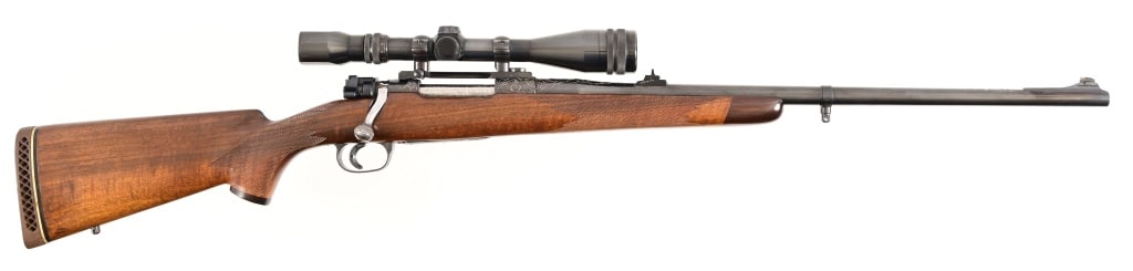 Custom Mauser Rifle in .458 x 2 Caliber: SN 62091. No makers marks. Beautiful custom rifle, engraved receiver, barrel and bottom metal. Jeweled bolt and extractor. High grade walnut stock. Custom trigger. Comes with Weaver 3x9 scope and slin