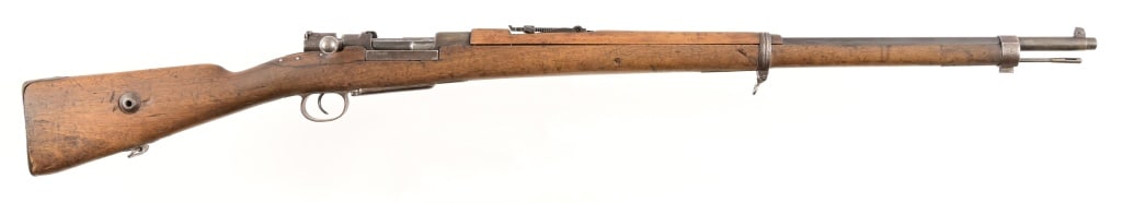 Turkish Ankara Model 1933 Bolt Action Rifle: Serial 1457. Mouser action rifle, caliber unknown. 30" barrel, bore is dark but with rifling. Stock has interesting repair near bolt. Modern.