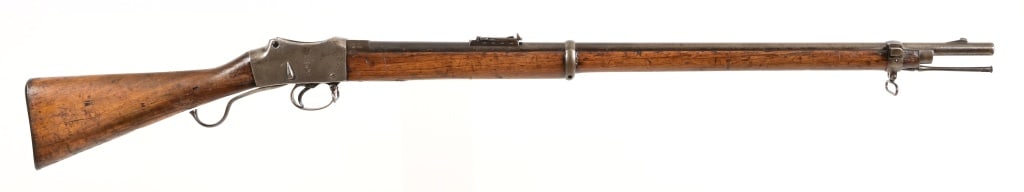 V.R. Enfield 1887 Mark IV Rifle: SN B6597. Marked V.R. ENFIELD 1887 IV 1. Two bands, with steel cleaning rod, ladder sight, 33" barrel, dark bore. Likely .577-450 caliber. Antique.