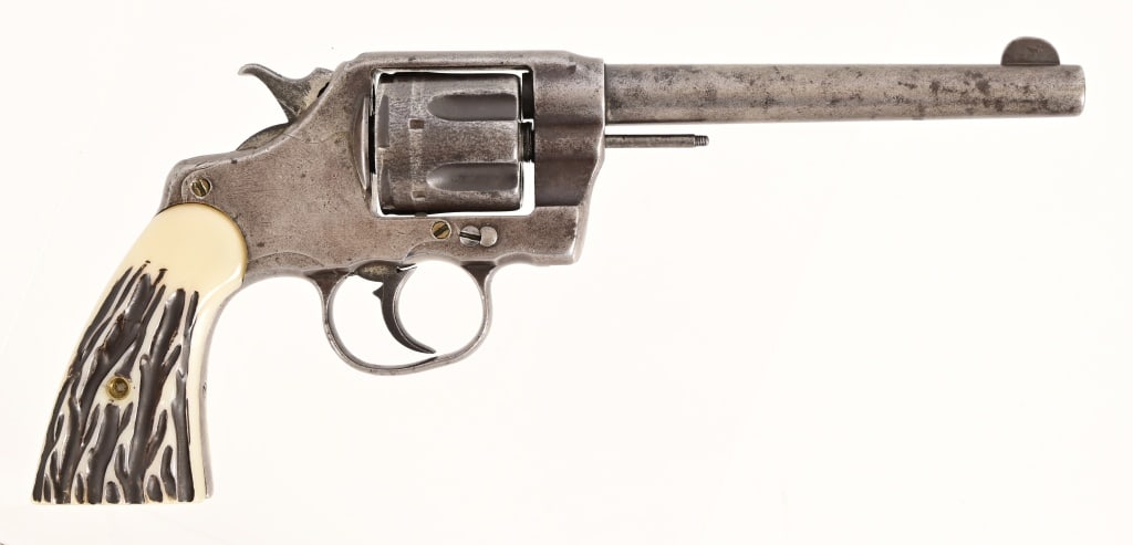 Colt DA Revolver .41 Caliber: SN 1182 Very early 1st. year production 1877. 5 7/8" barrel, bore is rough. Action works but has timing issues. Gray patina finish. Ejector rod tip missing. Faux stag grips. Nice period holster. Antiq