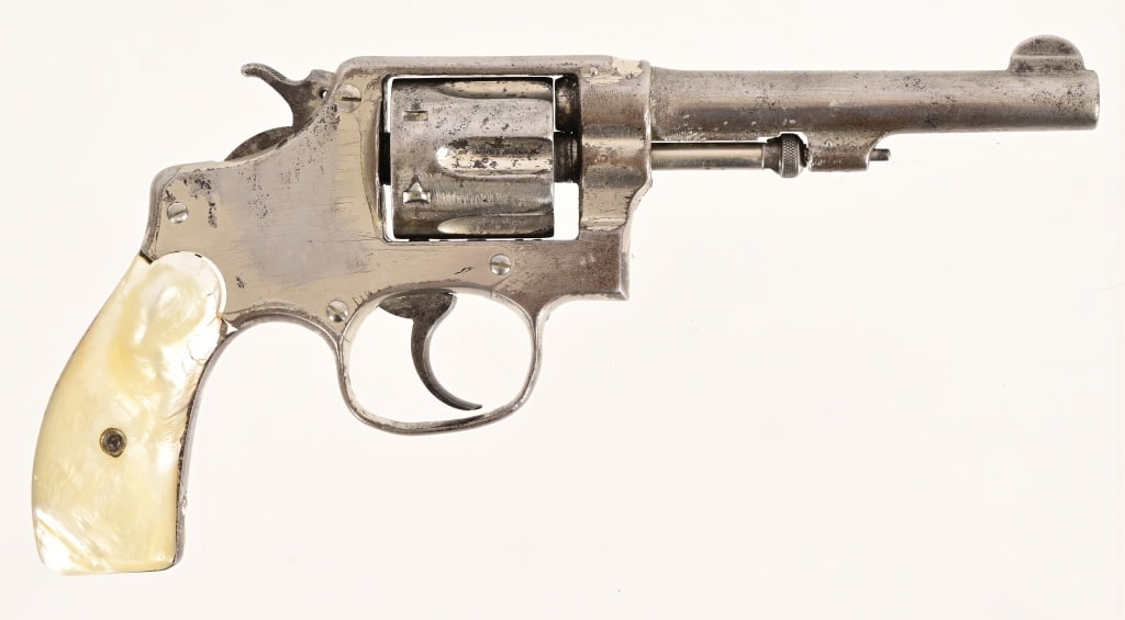 Smith & Wesson .32 Long Revolver: S/N 119148. Mother-of-pearl grips, left side with large chip , 4.25" barrel, bore is rough. Action works, finish is rough. Modern.