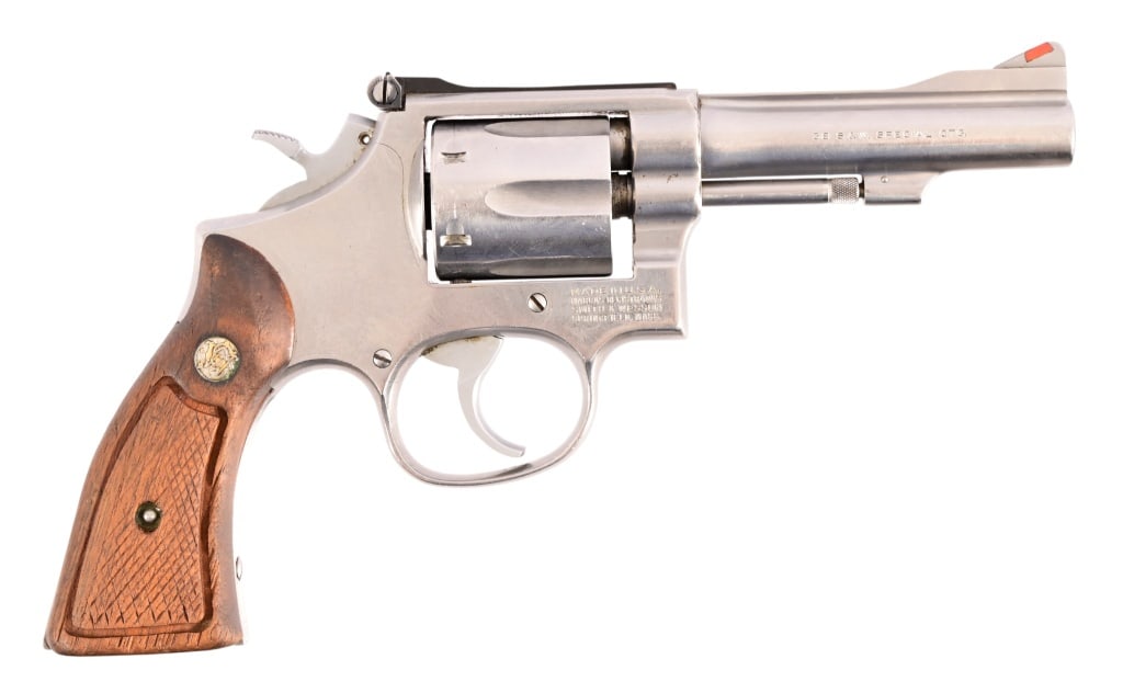 Smith & Wesson Model 67-1 Revolver .38 Special: SN 260K215. 4" barrel, decent bore. Stainless, tight action, pretty good condition. S&W wood grips. Modern.