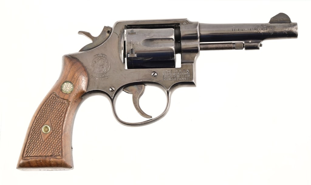 Smith & Wesson Model 10-5 Revolver .38 Special: SN C686364. 4" barrel, fair bore. Tight action, condition is fair. S&W diamond grips. Modern.