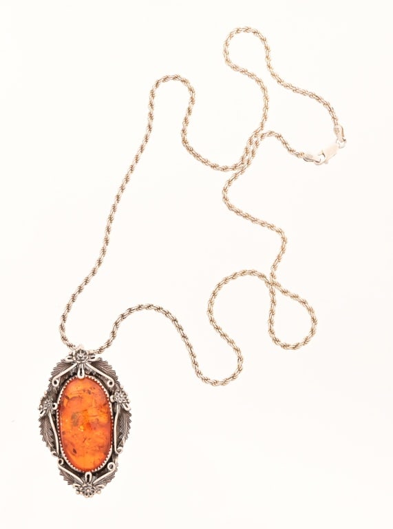 Peterson Johnson Navajo Sterling Amber Necklace: Peterson Johnson, Navajo marked Amber and Sterling Silver pendant necklace. Pendant measures 1.75" x 2.25", with pin-back so it can also be worn as a brooch. Italian marked 24.5" Sterling silver chain
