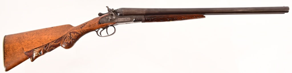 Antique Bridge Gun Works Hammered 12 Ga Shotgun: S/N 4845. Made by Bridge Gun Works, Belgium. 20" Damascus barrels, bores are dark. Very ornate carved stocks. Chip repair on left side near receiver. Locks work, action is rather loose. Antique.