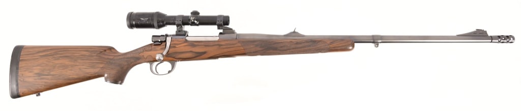 Charles Gagliano Custom Bolt Action .375 H&H: S/N A258680. Chambered in .375 H&H Magnum Improved (Ackley Improved), 24" compensated barrel, figured checkered stock. Custom built by Charles Gagliano in 1986. Swarovski 1,5-4,5x20 Habicht Optik.