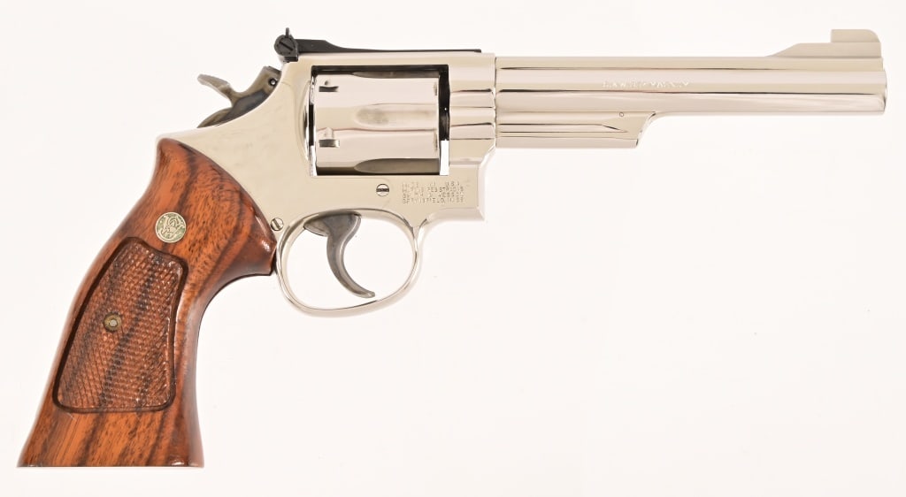 S&W Model 19-5 Revolver .357 Magnum: S/N ... Checkered Goncalo Alves (tigerwood) grips, nickel finish, 5 7/8" barrel. Standard hammer and trigger. Modern