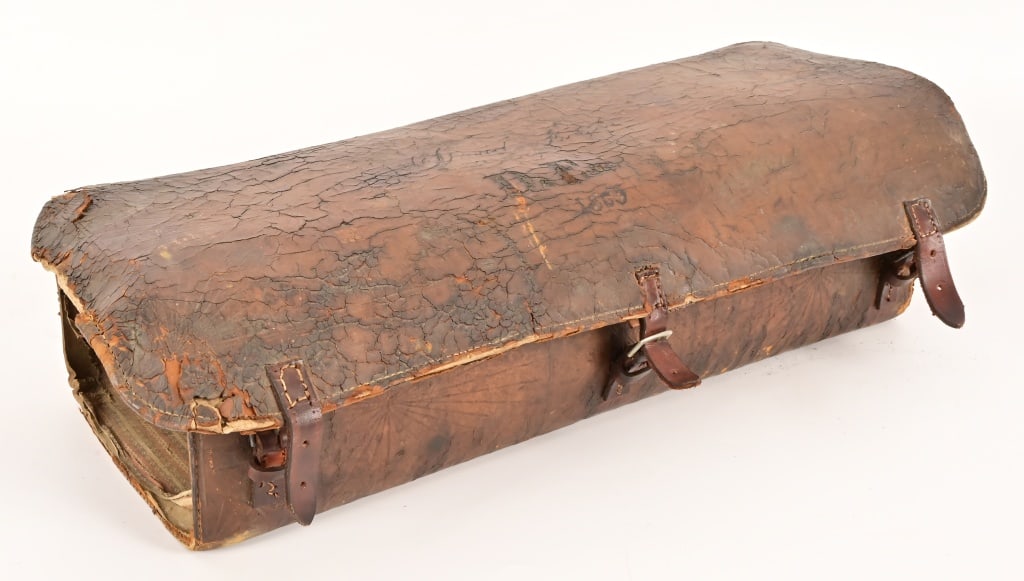 Antique Leather Saddle Valise: With condition issues. Marked with "D.F. 1865 on top cover. measures 23" long x 8 1/2" deep x 7 1/2" tall.