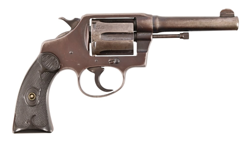 Colt Police Positive .38 Special Revolver: S/N 128290. Blued finish, 4" barrel, checkered Colt rubber grips. Cylinder issue staying full lock. Modern