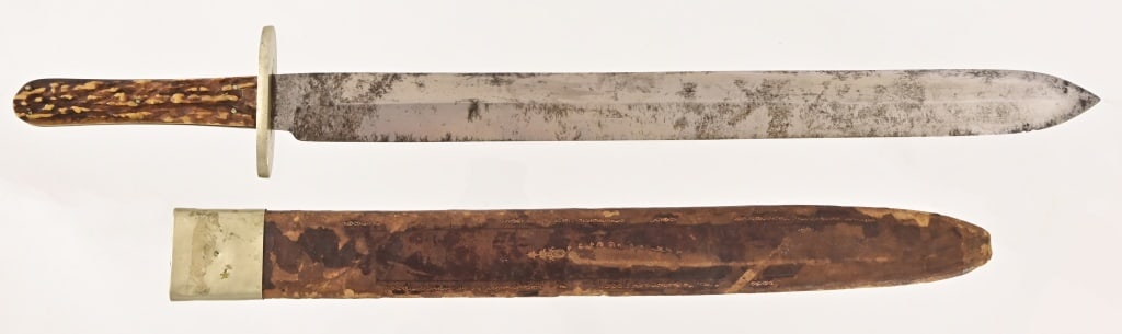 Rare Huge Wm. Jackson & Co Sheffield Bowie Knife: Marked "Wm. Jackson & Co. Sheaf Island Works, Sheffield", Massive 18.5" Bowie/Spear-point blade, brass guard, stag antler hands. Includes original sheath. Overall length of knife is 24 inches.