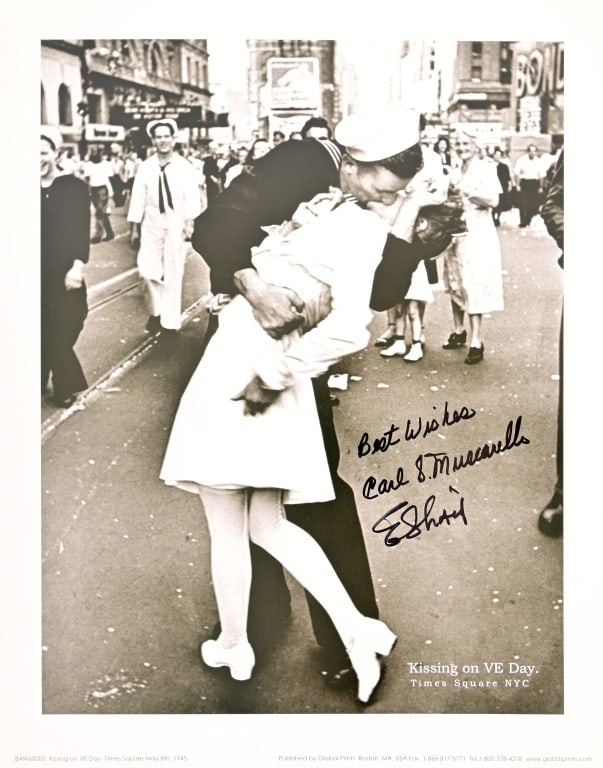 WWII Times Square "Kiss" Photo Autographed: Photo print of the famous Eisenstaedt "Kiss" photo, taken in Times Square at the end of WWII, 11x14, signed by photob subjects, Edith Shain and Carl Muscarello. Provenance includes R&R Auction COA.