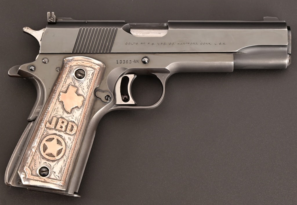 Texas Ranger Joe Davis' Colt National Match 1911: SN 13383-NM. Colt National Match model. 5" barrel. Mexican silver and gold inlay grips with JBD, State of TX and badge on right grip. Nice custom holster. Modern.