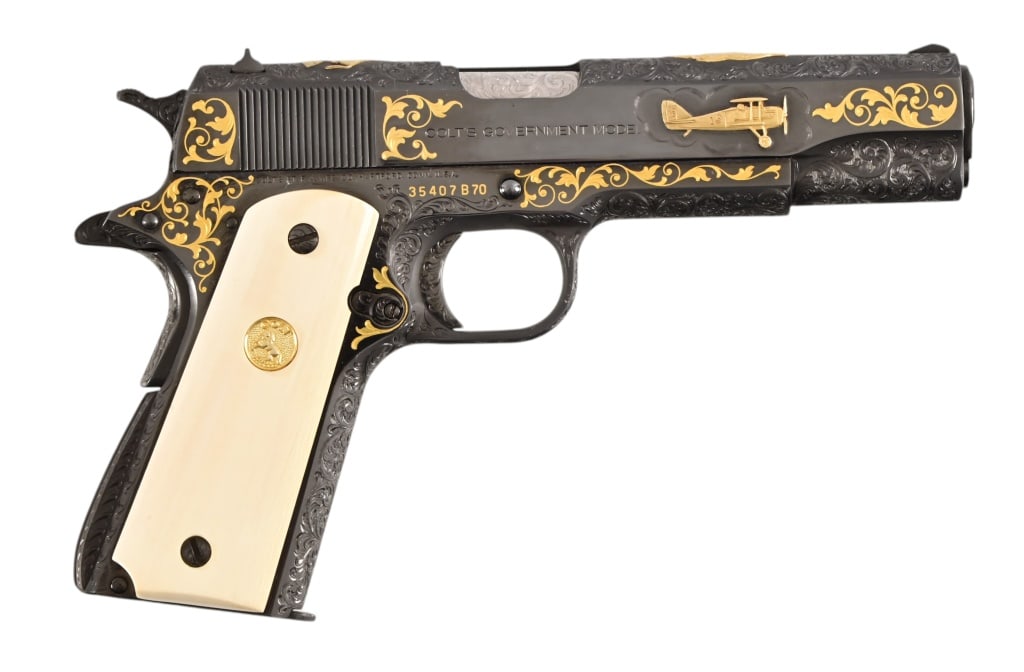 Alvin White Engraved Colt Gov't 1911 Gold Inlay: S/N 35407B70. Engraving attributed to Alvin White with Eddie Richenbacker's WW1 fighter plane in gold.
