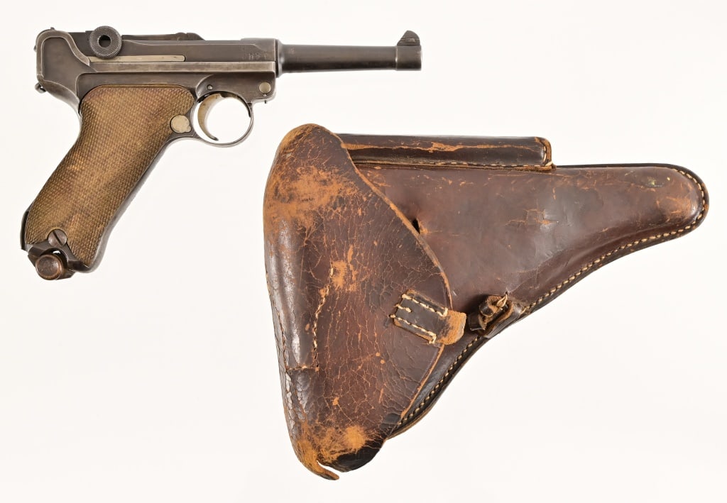 German Luger Pistol Erfurt 1916: SN 2107. 4" barrel, fair bore, appears to be 9MM Cal. Matching numbers, working action. Grip is marked "4.E.M.G.K.18.A.K". Magazine is not numbered to gun buth has wood base. Comes with worn but intac