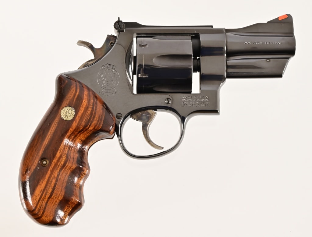 S&W Model 24-3 Revolver .44 Special: AEM1195. Blued finish, 3" barrel, deluxe wood grips. Very good condition. Modern.