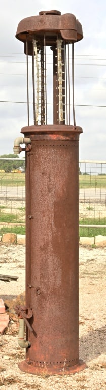 Relic Gas Pump: No globe or glass cylinder. Approximately 8' tall. Sold as is where is. Must be picked up at location. Site is within 5 miles of auction house.