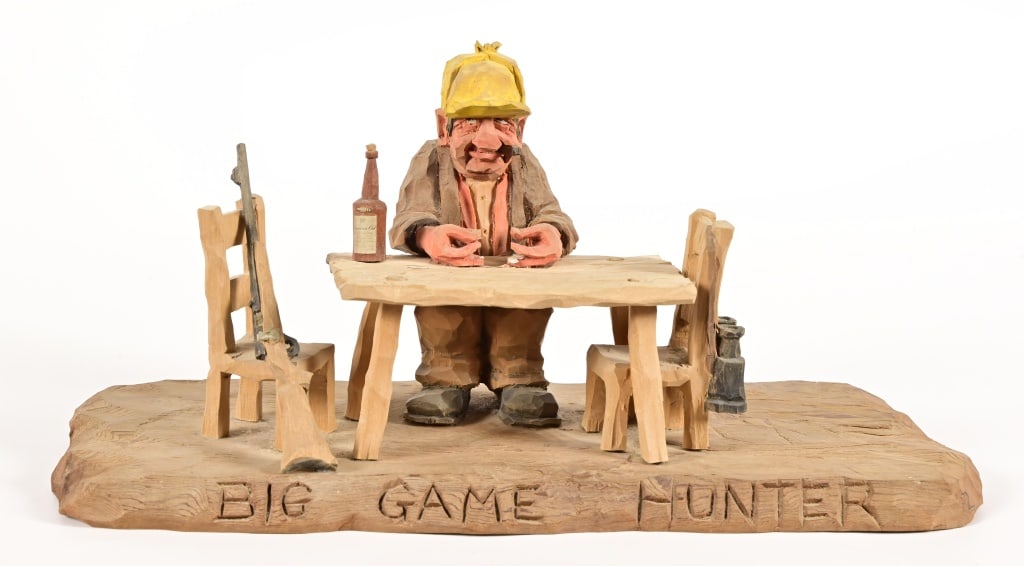 Gene Zesch Big Game Hunter Wood Carving: Gene Zesch "Big Game Hunter" original wood sculpture. 14 x 6 1/2 x 6 1/2.From the estate collection of former Mobil Oil President L.H. True. Gene Zesch is famous for his wood carvings reflecting