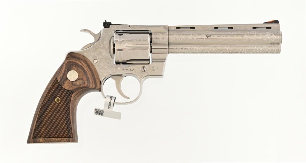 Engraved Colt Python .357 Magnum Revolver: S/N: PY201765. 6" barrel, stainless steel, wood grips, new unfired, in original factory box. New model Python. Modern.