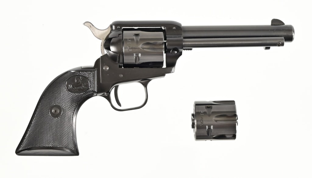 Colt Single Action Frontier Scout .22 / .22Mag: Also included is a .22 magnum cylinder. 4 3/4" barrel, in original Colt box. Modern.