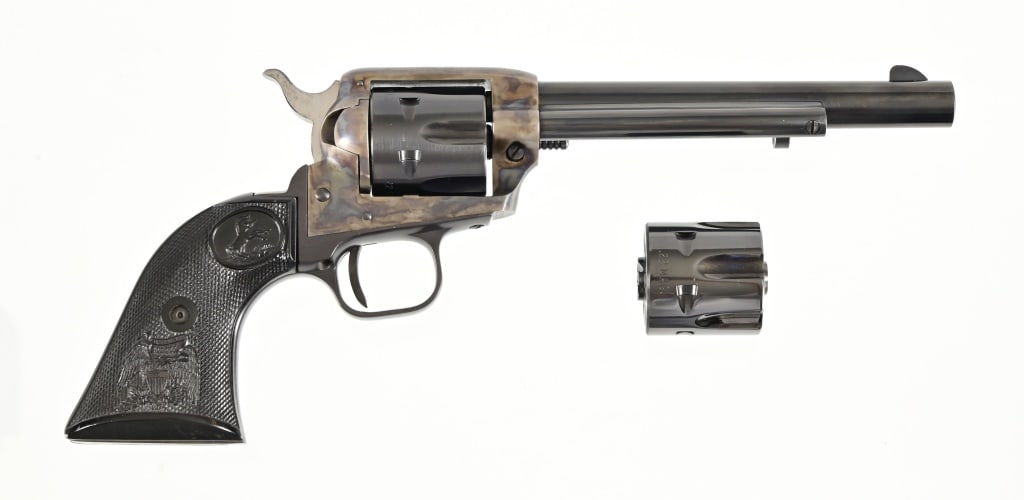 Colt Peacemaker .22 - .22 Magnum Revolver: Also included is a .22 magnum cylinder. 6" barrel, unfired, in original Colt box. Modern.