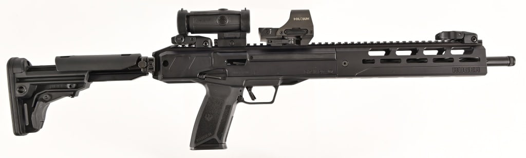 Ruger LC Carbine 5.7x28 Semi Auto Rifle w/Optics: S/N 930-23740. Holosun optic with Holosun magnifier, Ruger flip up rear/front sights, and 1 extra magazine. 16 1/2" barrel. Modern.