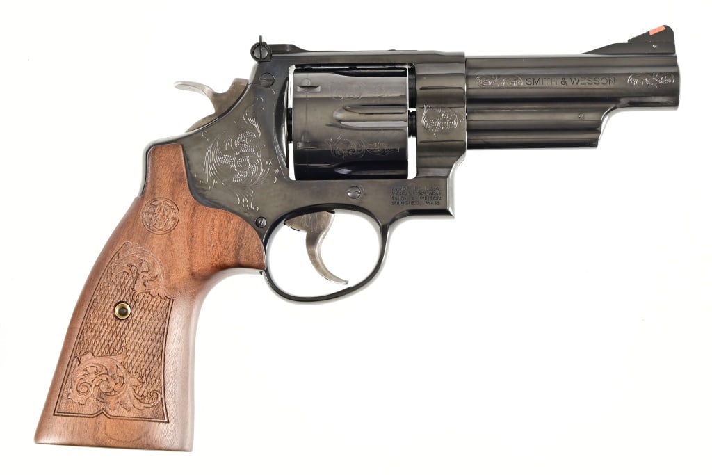 S&W Model 29-10 .44 Magnum Revolver: S/N DRU3713. 4" barrel. Some engraving. In original factory case. Modern.