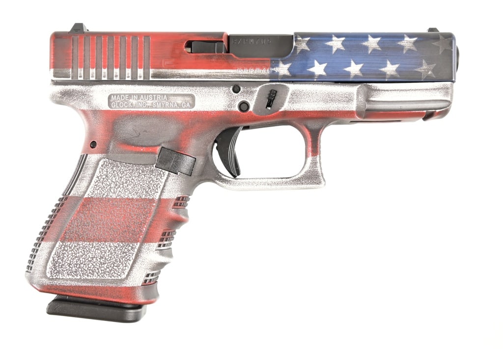 Glock 19 - American Flag 9 MM Pistol: S/N BXPM705. In original factory box. 4" barrel. 2 Magazines. Modern.